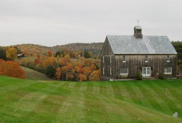 Autumnal landscape including farmhouse in New England