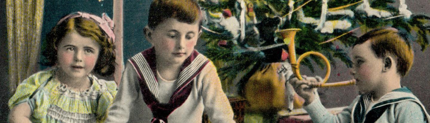 children around christmas tree