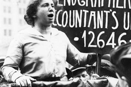 Vintage photo of activist giving a speech outdoors at a podium