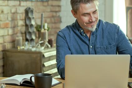 Researcher at home with laptop