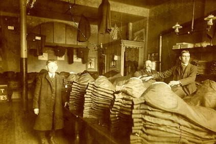 Black and white photograph of two men in a large room