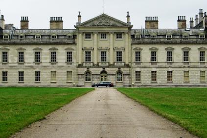 Car in front of a manor house